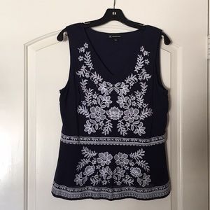 Sleeveless blue with white flowers peplum top